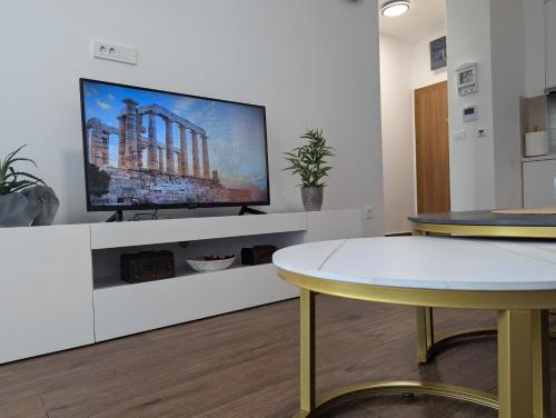 Una televisión o centro de entretenimiento en Dea apartment