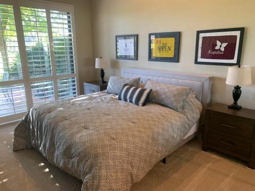 a bedroom with a bed with two pillows on it at Relax in Palm Valley Comfort in Palm Desert