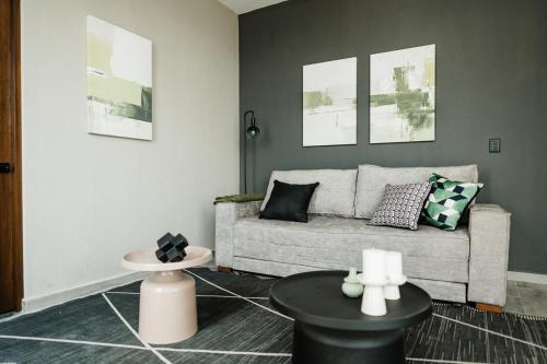 a living room with a couch and a table at Loft303 in Aguascalientes