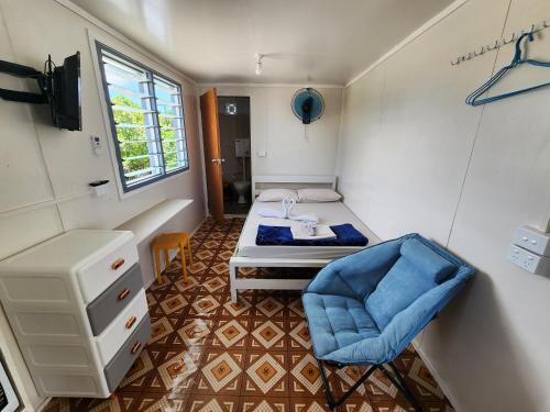 a small room with a bed and a chair at GoodWorks Accommodation in Yangor