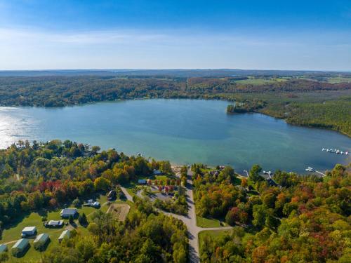 an aerial view of a lake in the fall at Private & Convenient-Hot tub-Fire Pit-Game room! in Petoskey