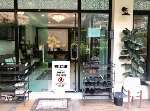 a welcome sign in the door of a store at Villa Thai Orchid (adult only) in Chiang Mai
