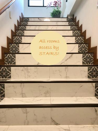 a sign that reads all rooms accessed by stairs at Villa Thai Orchid (adult only) in Chiang Mai
