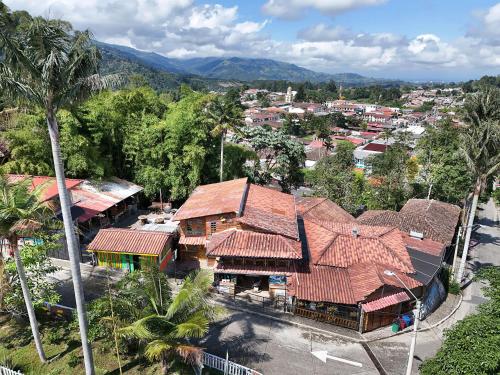 an overhead view of a town with buildings and trees at El Encanto Mountain Cabin in Salento