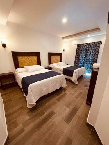 Postel nebo postele na pokoji v ubytování Gran Hotel Yacatas