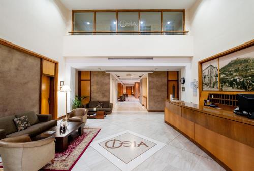 a lobby of a hotel with a reception desk at Fthia Hotel in Lamía