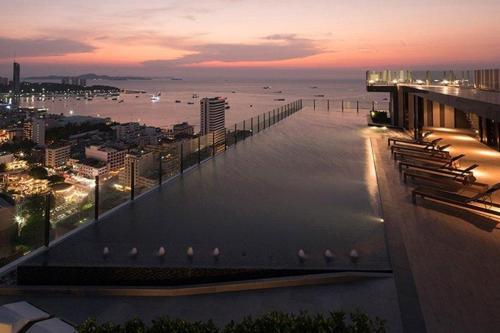 a view of the ocean at sunset from a building at The Base Central Pattaya by Mickey in Pattaya