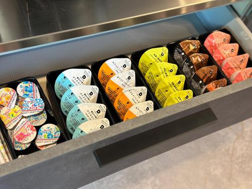 a drawer filled with lots of different colored skateboards at LOCA THE JUNPU Moroyose in Moroyose