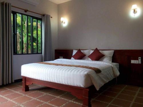 Katil atau katil-katil dalam bilik di Siem Reap Lodge Eecfc Homestay VSV