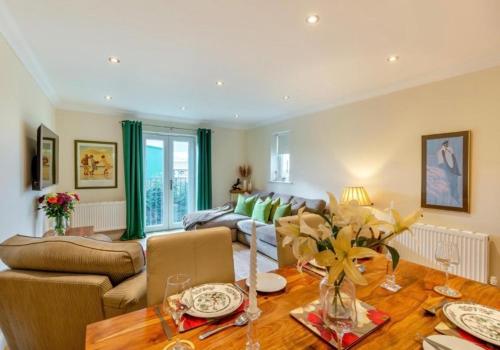 a living room with a table and a couch at Inglewood Apartment, Ingleton, Yorkshire Dales National Park, Famous Three Peaks, Near The Lake District, Pets Are Welcome in Ingleton