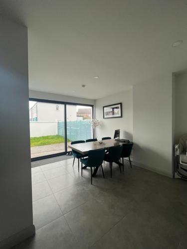a dining room with a table and chairs at Nine Hatherans in Portstewart