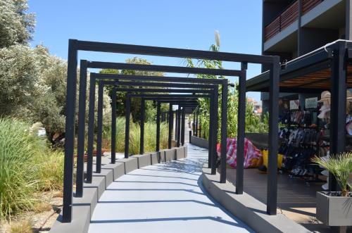 a walkway in front of a building at Cook's Club Ialysos Rhodes in Ialyssos