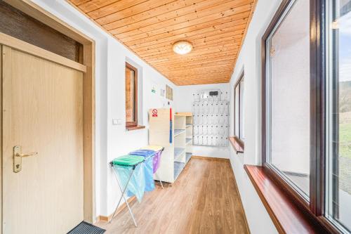 a tiny house with a hallway with a door at Ubytování u Foltýnů - Zelená Lhota in Nýrsko