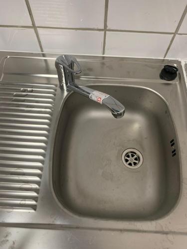 a sink with a faucet sticking out of it at HD Rooms in Bremen