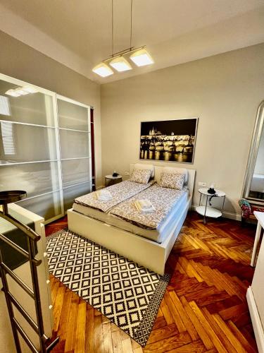 a bedroom with a bed in a room at Four reasons apartment in Prague