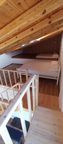 a bunk bed in a cabin with a wooden ceiling at Summer Villa with sea view,6 min drive from airport, near Seitan Limania beach in Khordhákion