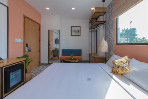 Postel nebo postele na pokoji v ubytování Shoho Hotel Nha Trang
