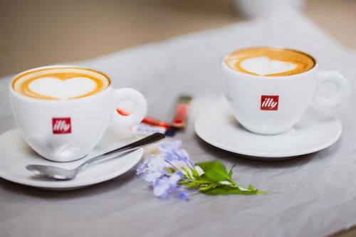 two cups of coffee sitting on a table at ATKV Buffelspoort in Rustenburg