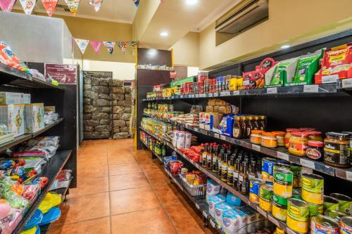 a store aisle filled with lots of food and drinks at ATKV Buffelspoort in Rustenburg