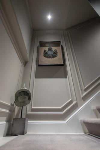 a room with a ceiling with a picture on it at Mert Boutique Hotel in Korçë
