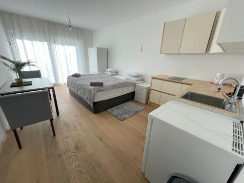 Ein Bett oder Betten in einem Zimmer der Unterkunft Green Garden Apartments