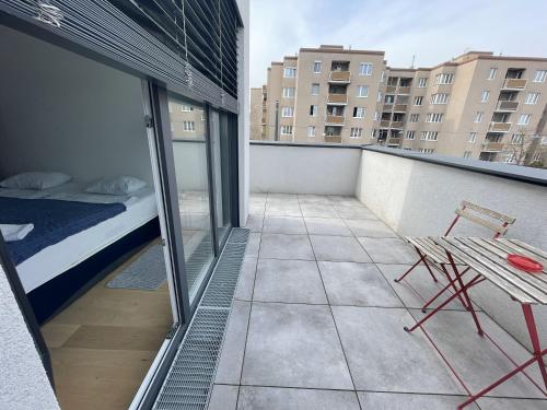 Ein Balkon oder eine Terrasse in der Unterkunft Green Garden Apartments