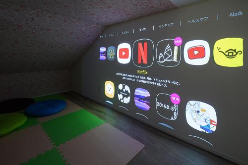 a room with a wall with different apps on it at HANA HOUSE Tokyo - Family House near Haneda Airport in Tokyo