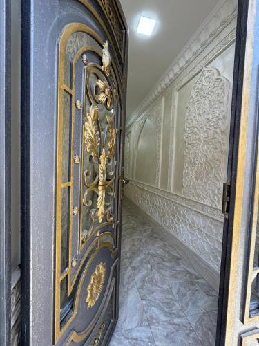 a door in a room with a wall at Boutique Boulevard Bukhara in Bukhara