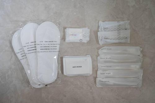 a group of white envelopes and white shoes and papers at Flex cella satozuka in Ōmagari