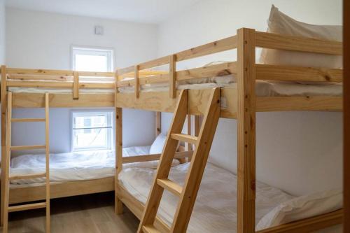 a couple of bunk beds in a room at Flex cella satozuka in Ōmagari