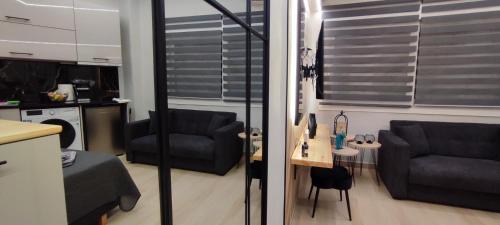 a living room with two chairs and a couch at Urban Nest Veria downtown in Veria