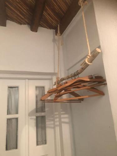 a chandelier hanging from the ceiling in a room at TaVLaDo Cycladic house in Serifos Chora