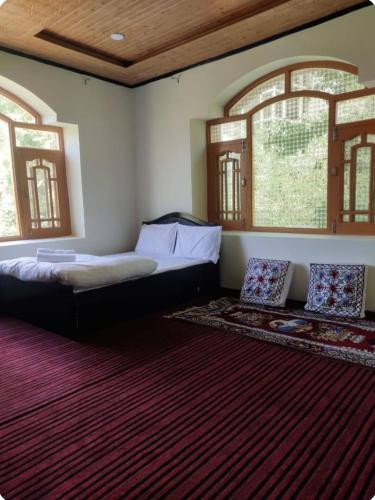 Ένα ή περισσότερα κρεβάτια σε δωμάτιο στο Tspn GUEST HoUsE