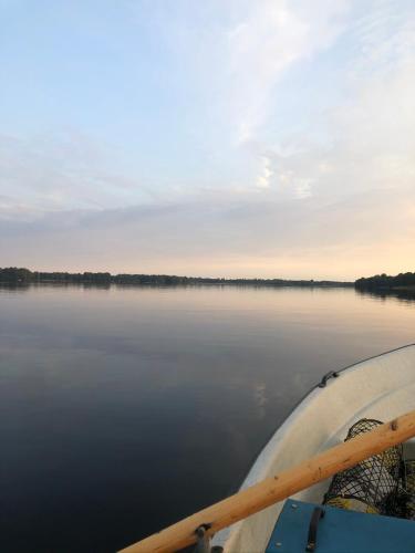 a person in a boat on a body of water at Magasinet in Ingelstad