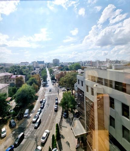 a view of a city street with cars on the road at The Central Collection Apartments in Chişinău