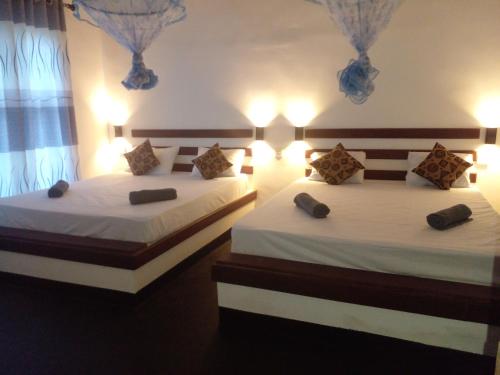 Ένα ή περισσότερα κρεβάτια σε δωμάτιο στο Hidden Garden Homestay