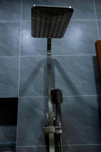 a chair sitting on top of a tiled floor at Tân Hiệp Hotel in Bùi Tiếng