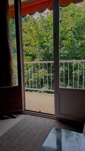 an open door with a view of a balcony at Le Parc in Sarcelles