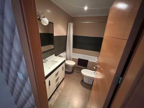 a bathroom with a sink and a toilet in it at Piso 3 Dormitorios in La Roda