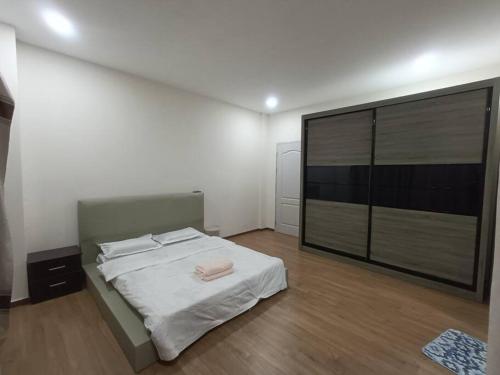 En eller flere senge i et værelse på VI Homelite Eco Park