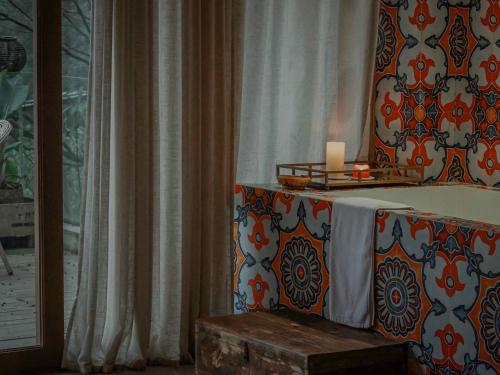 a room with a table with a candle on it at Hide and see in Sha-p'ing-pa