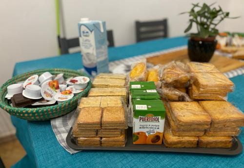 a tray of bread and pastries on a table at Alloggio al binario 9 e tre quarti in Civitavecchia