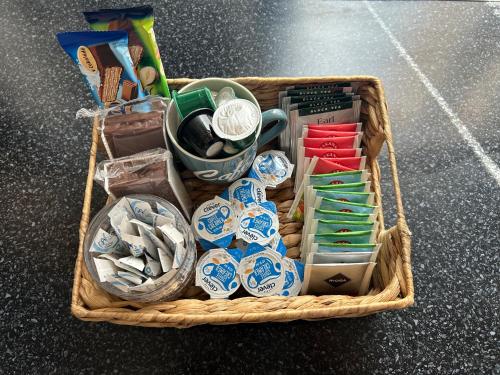 a basket filled with different types of items at Apartmány u Kubíků in Hradec Králové