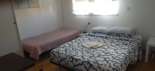 Ένα ή περισσότερα κρεβάτια σε δωμάτιο στο Quarto privado 1