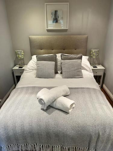 a bedroom with a bed with towels on it at One bed flat close to Exeter centre in Exeter