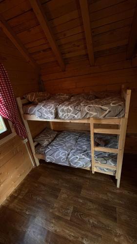 a bedroom with a bunk bed in a cabin at ABBA Ethno House in Gusinje