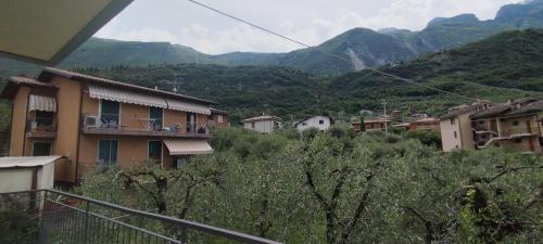 a view of a town with mountains in the background at The green house in Malcesine