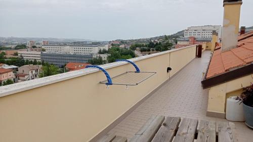 a bench on the roof of a building at La terrazza di Maja in Chieti