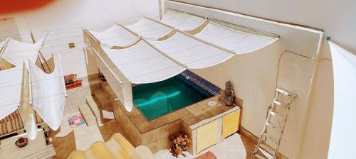 a swimming pool in a house with a swimming pool at Villa Yandre Garden House - Ayamonte in Ayamonte
