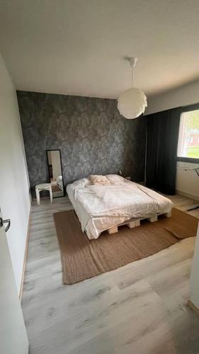 Ένα ή περισσότερα κρεβάτια σε δωμάτιο στο Apartmentmuikku